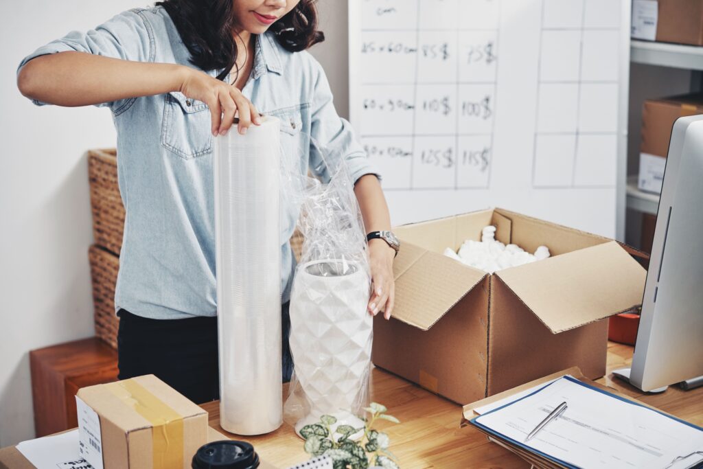 woman packing order box